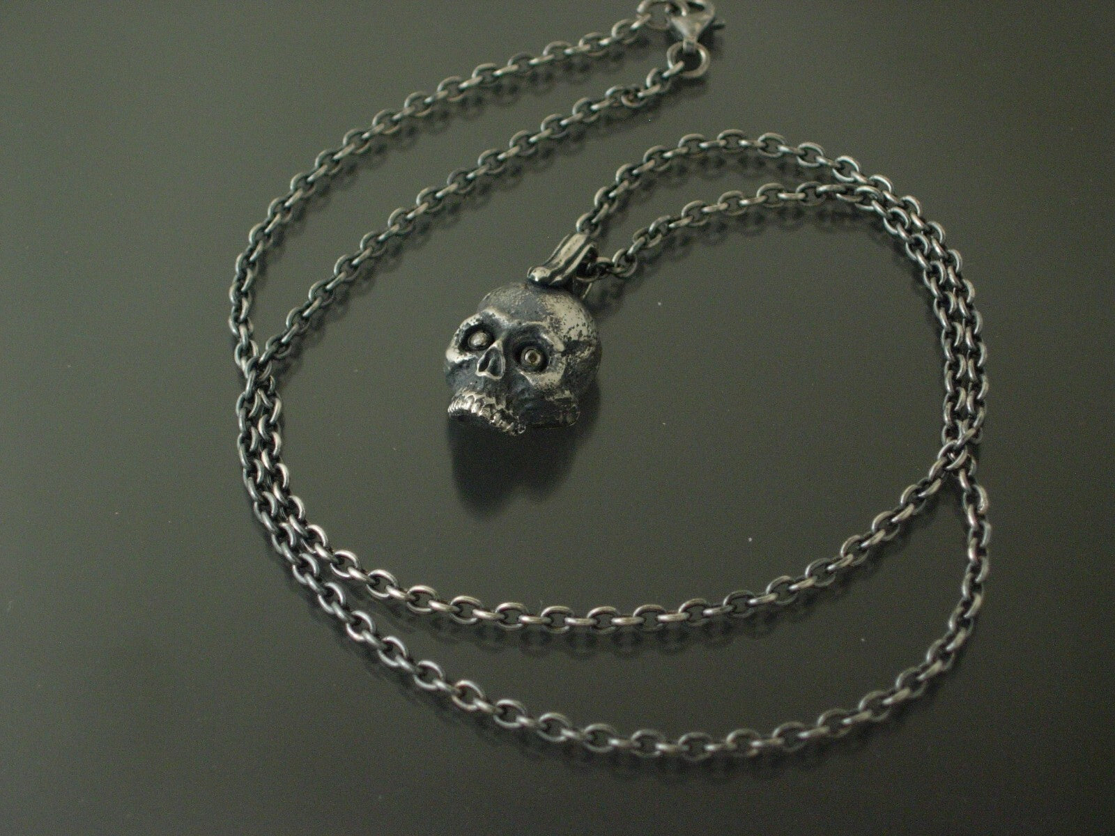 925 silver gothic skull pendant with diamond eyes.