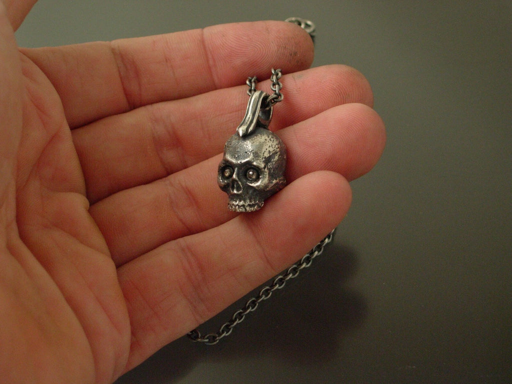 925 silver gothic skull pendant with diamond eyes.