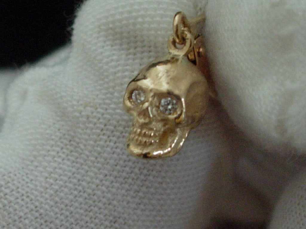 GOLD SKULL EARRINGS W LAB DIAMONDS